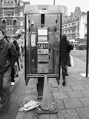 Telephone booth on a busy London street