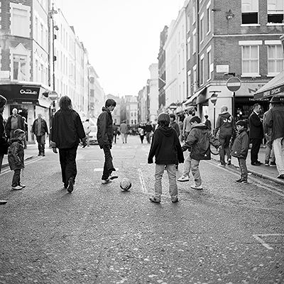 Football in Old Compton Street, Soho London