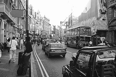 Cars and Bus going through London Shaftesbury Avenue in 1999